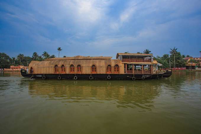 Explore the serene backwaters on a luxurious houseboat in Alleppey