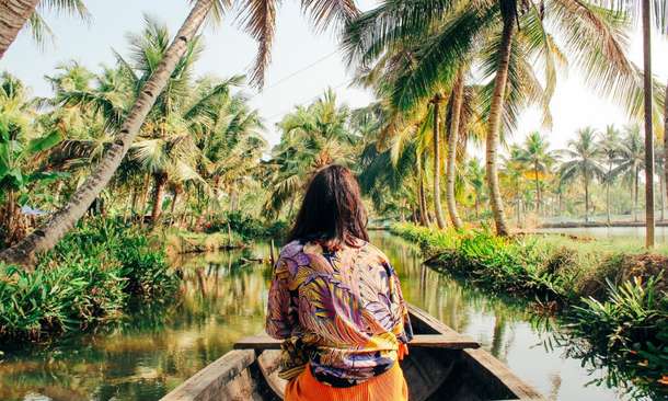 Woman enjoying in Kerala backwaters