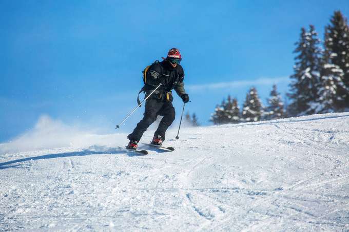 Experience the thrill of skiing down the slopes