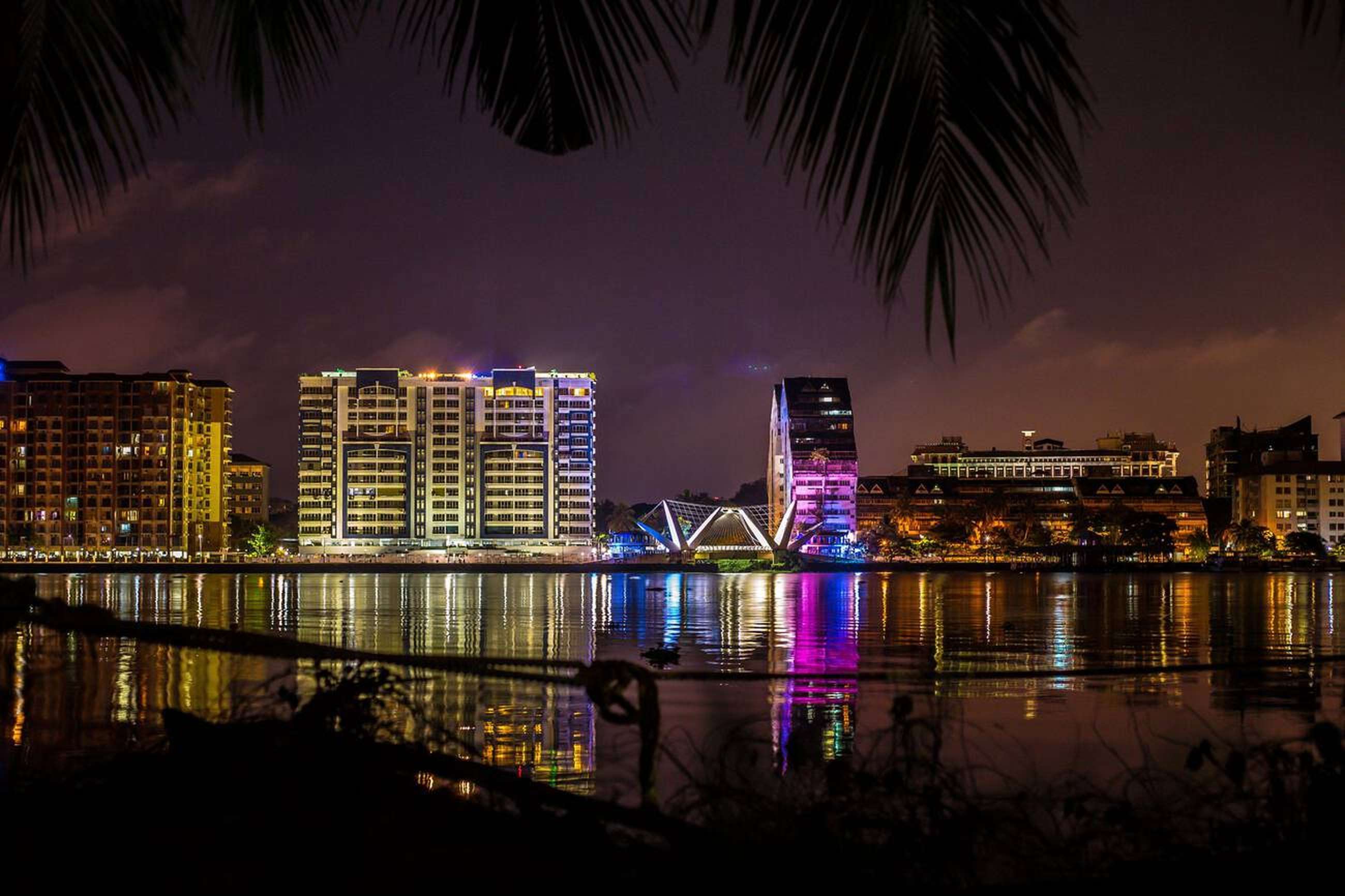 Stroll along Marine Drive, illuminated by city lights