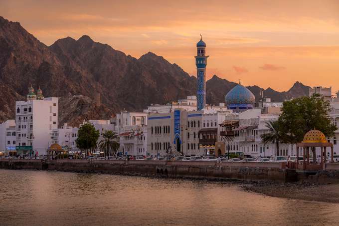 Catch stunning sunset views over Muscat's historic waterfront