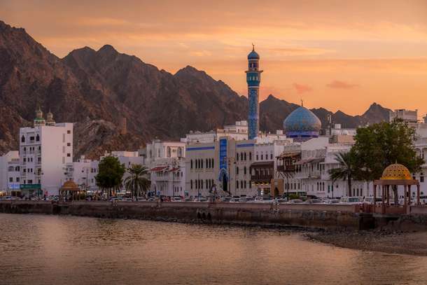 Catch stunning sunset views over Muscat's historic waterfront