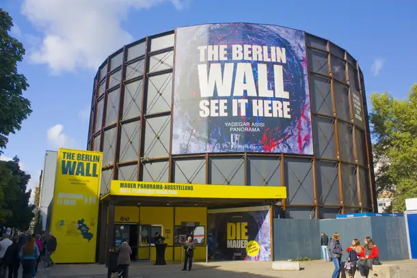 Enter Asisi Panorama: Die Mauer by entering the specially manufactured rotunda on the site of this famous Checkpoint Charlie